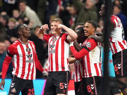 
Sunderland’s Daniel Ballard (second left) celebrates scoring his side’s first goal during the English Premier League football match against Arsenal in Sunderland, England, yesterday.