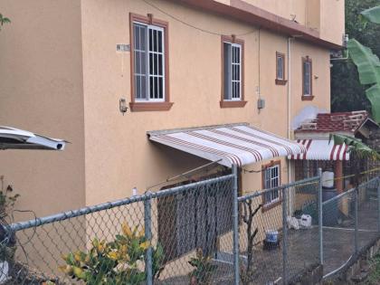 The lower floor apartment where mother and daughter were discovered dead in the Keystone area of Spanish Town, St Catherine, on Thursday.