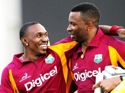Former West Indies cricketers Kieron Pollard (right) and Dwayne Bravo.