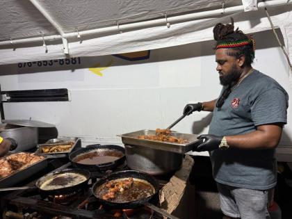 Portland businessman Telief ‘Peter’ Hall works in a mobile kitchen in St Elizabeth, serving warm meals to residents affected by Hurricane Melissa.