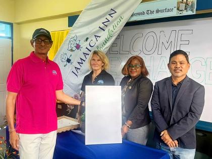  Kyles Mais, general manager Jamaica Inn, displays the Starlink Gen 3 system presented to Exchange Primary, along with Belinda Morrow, board member, Jamaica Inn Foundation; Natalie Oates-Johnson, principal, and Gregory Chung, school board chairman.