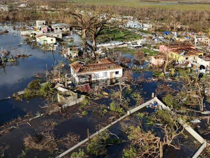 Debris surrounds damaged homes along the Black River, Jamaica, in the aftermath of Hurricane Melissa.