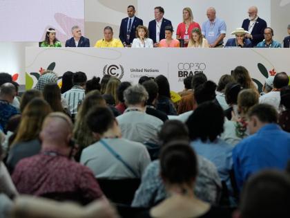 Sophia Hermans, deputy prime minister of the Netherlands, fourth from left sitting, speaks during a session surrounded by other countries at the COP30 UN Climate Summit, Friday, November 21, 2025, in Belem, Brazil. (AP Photo/Fernando Llano)