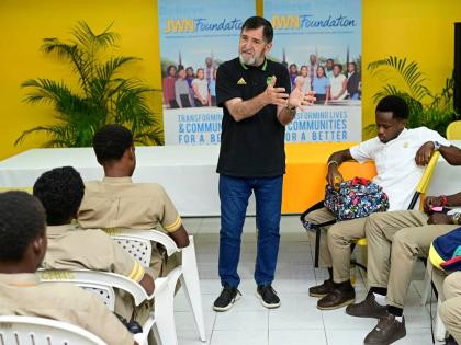 Former Reggae Boyz Technical Director Rene Simoes, speaks to students Garvey Maceo High School in Clarendon.