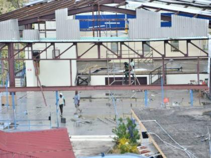 Volunteers repair a building at the Westwood High School for Girls in Trelawny during a repair and clean-up exercise at the school on Friday, November 21, 2025.
