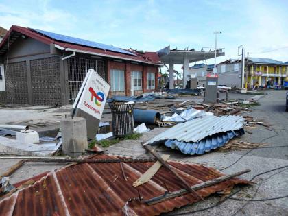 
A TotalEnergies sign sits amid rubble on Market Street in Falmouth, Trewlany, on Wednesday, October 29, 2025 after the passage of Hurricane Melissa, which swept through Jamaica on October 28.