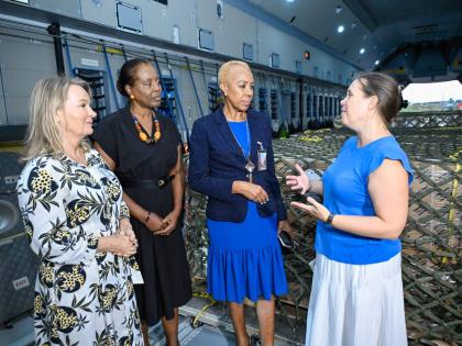 Minister of Finance and the Public Service, Fayval Williams (second right), listens to a point being made by Ambassador of Belgium to Jamaica, Ellen De Geest (right), while welcoming the arrival of 200 generators donated by the government of Belgium to sup