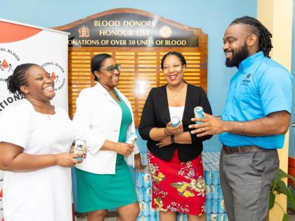 From left: Nurse Miller; Annalene Clarke-Christie, office manager; Keishawna Pinnock, assistant blood donor organiser, and Chevon Lewis, MPOWA brand manager at Wisynco Group Limited, share a moment at the official handover of 50 cases of MPOWA to the Natio