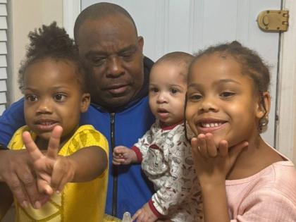 Sixty-five-year-old US Army veteran Godfrey Wade with three of his grandchildren.