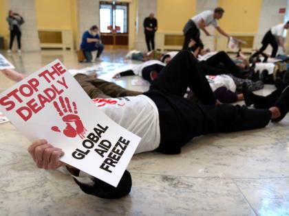 Demonstrators protest against cuts to American foreign aid spending, including USAID and the PEPFAR programme to combat HIV/AIDS, at the Cannon House Office Building on Capitol Hill Washington DC. 