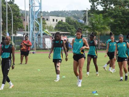 Reggae Girlz warm up ahead of a training session at the Montego Bay Sports Complex last year.