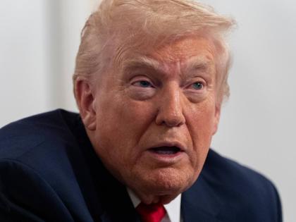 President Donald Trump speaks to reporters after speaking to troops via video from his Mar-a-Lago estate on Thanksgiving, Thursday, November 27, 2025, in Palm Beach, Florida. (AP Photo/Alex Brandon)