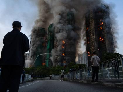 Smoke rises after a fire broke out at Wang Fuk Court, a residential estate in the Tai Po district of Hong Kong's New Territories.
