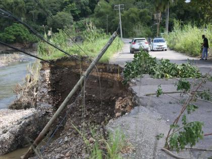 A light pole which was washed away during the passage of Hurricane Melissa sits on the side of a road in Pennants, Clarendon.
