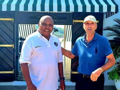 Dr Leahcim Semaj shares lens time with Round Hill Hotel and Villas managing director, Josef Fortsmayr, during one of his mindspa workshops for staff at the Montego Bay resort.