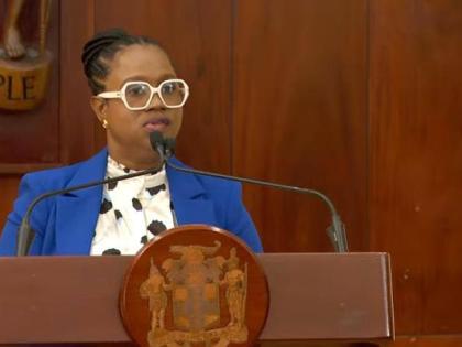 Students' Loan Bureau Executive Director Nickeisha Walsh speaking at a press conference at Jamaica House on December 3, 2025.