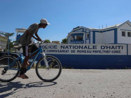  A man rides his bicycle past police station in Pont-Sonde, Haiti, October 7, 2024. (AP Photo/Odelyn Joseph, File)