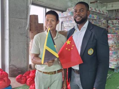 Montego Bay Mayor Richard Vernon (right) and vice-president of the Fujian Association of Jamaica, Yansen Li, at the handing over of Hurricane Melissa relief supplies by Chinese business communities in Montego Bay and Trinidad on Thursday.