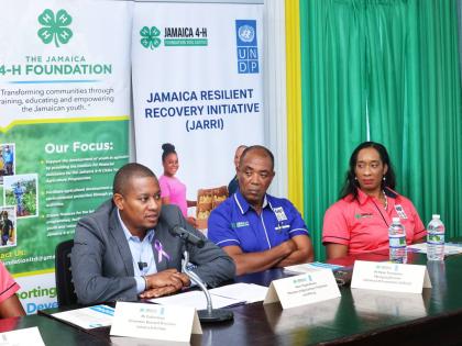 Minister of Agriculture, Fisheries and Mining, Floyd Green (left), addresses a press briefing on the Jamaica Resilient Recovery Initiative on December 3, 2025, at the Jamaica 4‑H Clubs’ Kingston and St Andrew office on Duke Street in Kingston. Lookin