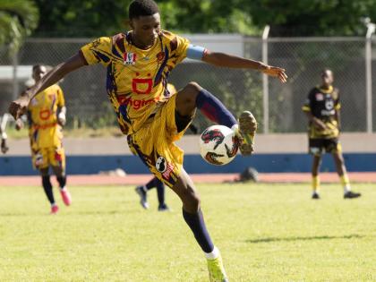 St Andrew Technical High School’s Richard Livingston controls a ball during a game against Kingston Technical High School at the Jamaica College Ashenheim Stadium on October 28.
