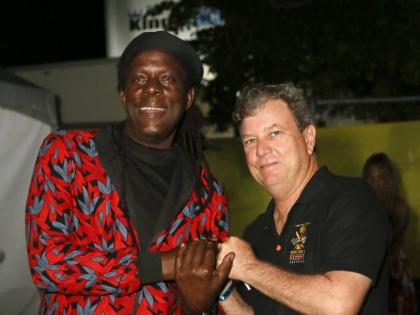 Richie Spice greets festival director Jason Henzell, moments after his surprise appearance.