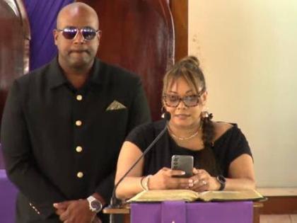 Dwight Crawford, deputy mayor of Montego Bay and councillor for the Spring Garden Division in the St James Municipal Corporation, and his sister Kimika Crawford, present tributes during the thanksgiving service for their father, businessman Ruel Alphanso C