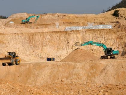 
In this December 10, 2010 photo, workers use machinery to dig at a rare earth mine in Ganxian county in central China’s Jiangxi province.
