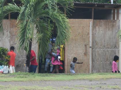 In this 2023 photo Haiti nationals are seen in the compound of the Seventh Day Adventist operated Camp Don in Robins Bay, St. Mary.