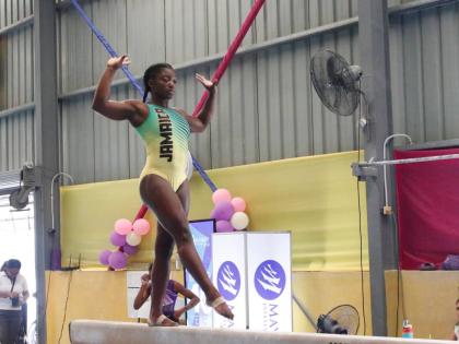 Alana Walker balances well on the beam as she competes in the recent Mayberry Investments Gymnastics Championships at the Jamaica College Auditorium. 