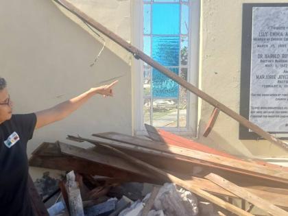 Paul Williams Photos 
Allison Morris points to the marble plaque mounted in honour of her parents and grandmother in St John’s Parish Church in Black River, St Elizabeth.