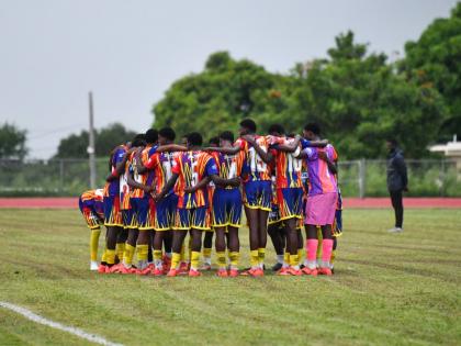 Matthew McKoy/Photographer 
St Andrew Technical High School players get into their customary huddle before an ISSA/WATA Manning Cup match. 