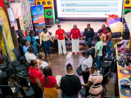 JMMB team members and parents at the recently organised CHAMP Parenting Conference in Montego Bay.