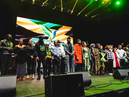 Most of the performers returned to the stage alongside Minister of Culture Olivia ‘Babsy’ Grange, US Congresswoman Yvette Clarke, and VP Records co-founder Patricia Chin and others to sing the National Anthem.