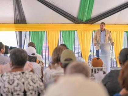 Prime Minister Dr Andrew Holness addressing a land titling ceremony at the Lacovia Community Centre in St Elizabeth on Friday, December 12, 2025.