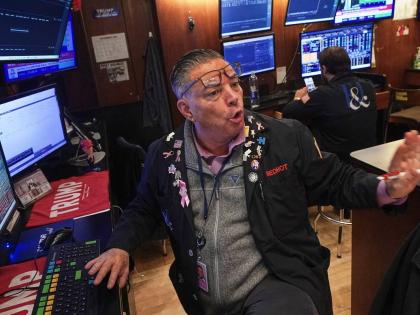 Trader Jonathan Mueller works on the floor of the New York Stock Exchange, Thursday, December 11, 2025. 