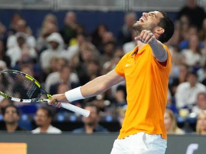 Carlos Alcaraz reacts after winning the first set against Joao Fonseca during the Miami Tennis Invitational tournament on December 8, 2025, in Miami, United States.