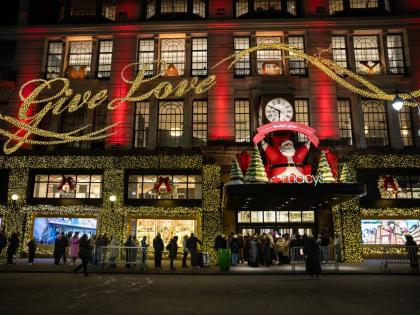 Black Friday shoppers wait in line to enter Macy’s flagship store in New York.