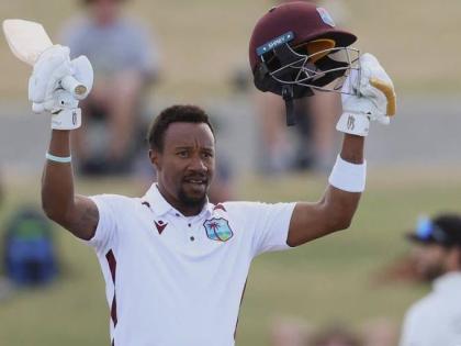 
Kavem Hodge raises his bat on the occasion of scoring a half-century against New Zealand on the third day of the third Test against New Zealand at the Bay Oval in Mount Maunganui on Friday night.