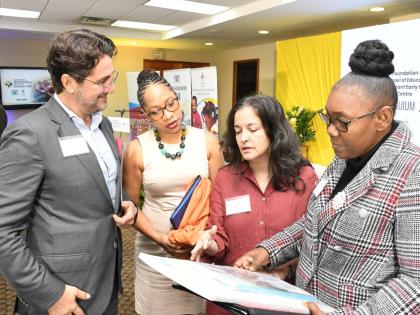  Dr Rebecca Tortello (second right), education specialist at the United Nations Children’s Fund, leads a conversation on the National Early Screening Pathway document with (from left) Dr Emre Ozaltin, lead economist for the Caribbean at the World Bank; P
