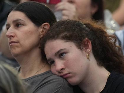 People attend a ceremony to mark the National Day of Reflection for victims and survivors, at Bondi Beach in Sydney.