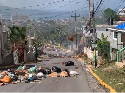 Roadblocks mounted by residents of Boulevard in Rose Heights, St James on December 24, 2025 to protest the absence of water in the area.