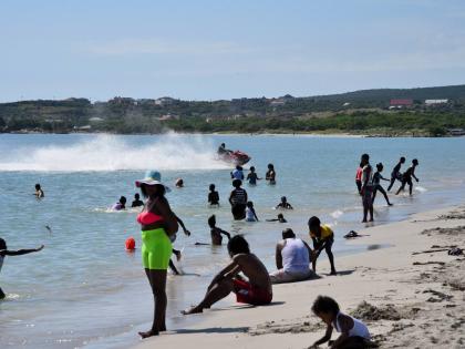 People relax along Hellshire Beach in St Catherine.