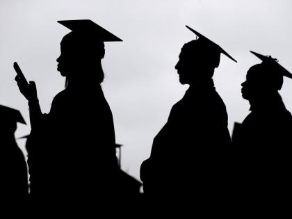 Graduates line up before the start of a community college commencement in East Rutherford, New Jersey USA (AP Photo)