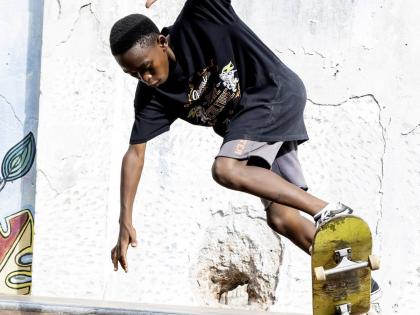 Ramese Wright of the EDUSKATEME Team  in action at the Germaican Skate Tour at Kingston Creative parking lot on Water Lane last weekend.