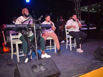 From left: Adiel ‘King Diel’ Thomas, Justin ‘Just King’ Walker, and Carl ‘Lee Lee King’ Scharschmidt of the musical group Island Kings entertain the audience at the Kings of Christmas concert, held at Sunken Garden in Hope Botanical Gardens on 