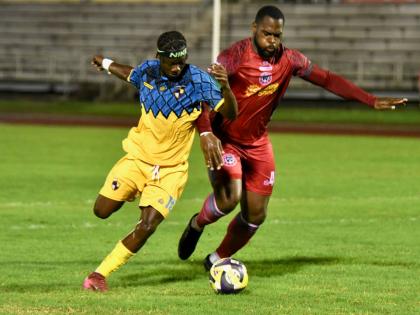 Racing United’s Nickyle Ellis (left) and Montego Bay United’s Josiah Trimmingham battle for the ball during their Jamaica Premier League match at the Montego Bay Sports Complex on Sunday, October 19, 2025.