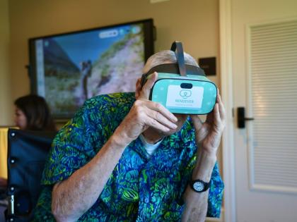 
Bob Rogallo watches video through a Rendever virtual-reality headset at the Forum at Rancho San Antonio retirement community in Cupertino, California, USA. 