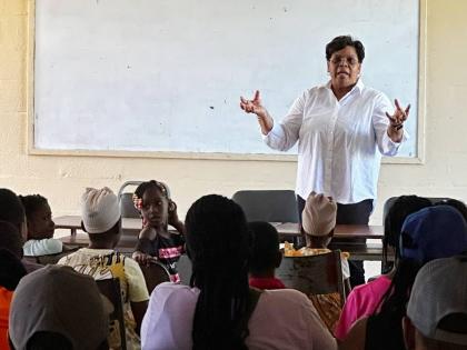 Dr Marsha Smith making a presentation to grandparents, parents and children at the Newell High School in St Elizabeth. 