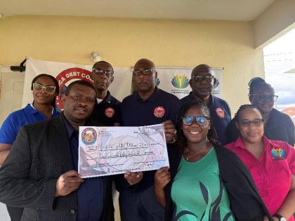 The Jamaica Debt Collectors Association donated $250,000 to the Maxfield Park Children’s Home. Pictured at the recent symbolic cheque handover are (back row, from left) Rosemarie Bromwell, Hudson Grant, Dugal Rowe, Neville Warmington Sr, and Neliisa Asph
