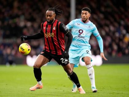 Bournemouth’s Antoine Semenyo (left) and Burnley’s Josh Laurent vie for the ball during the English Premier League  match between Bournemouth and Burnley at the Vitality Stadium, in Bournemouth, England, Saturday, December 20, 2025. 
